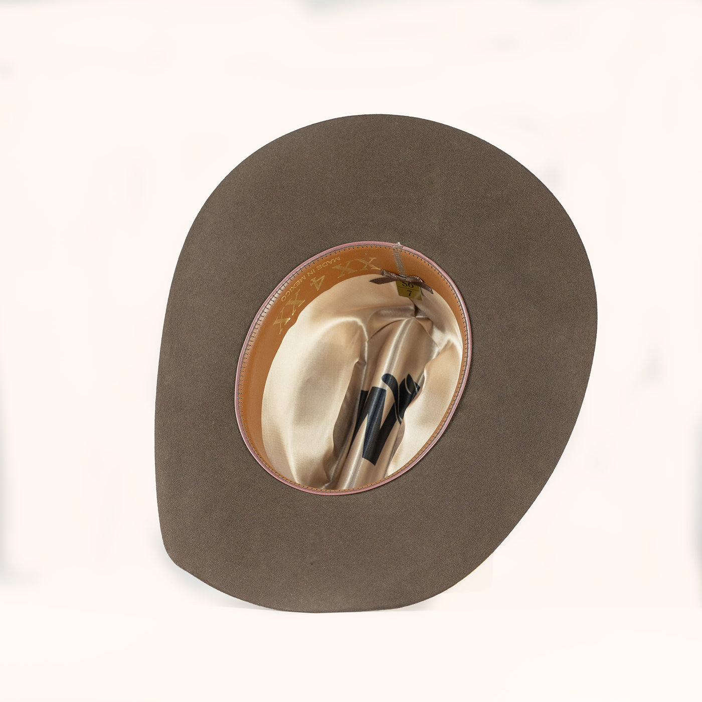 Brown hat with a leather sweatband on a white background