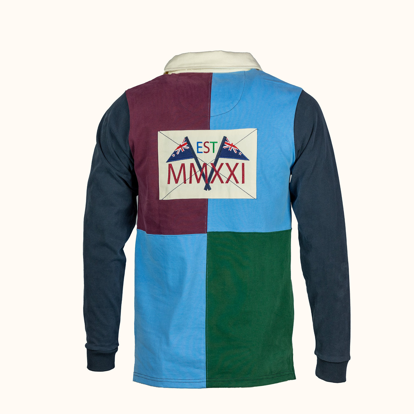 Long-sleeve rugby shirt with a colorful badge on the back featuring text and flags.